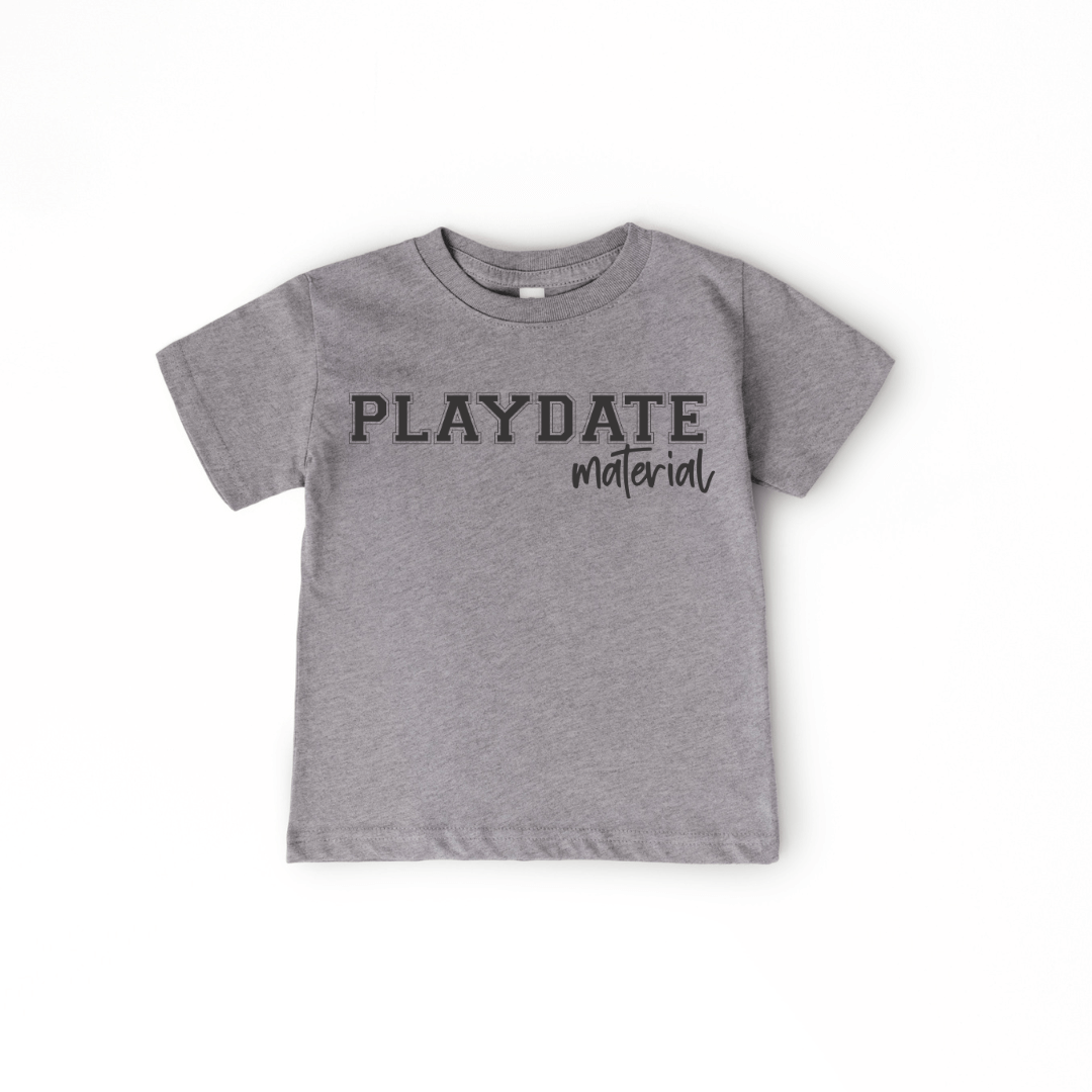Granite Heather CVC grey toddler graphic tee with ‘PLAYDATE Material’ design, soft fabric, stylish and comfortable, available at our children’s boutique.